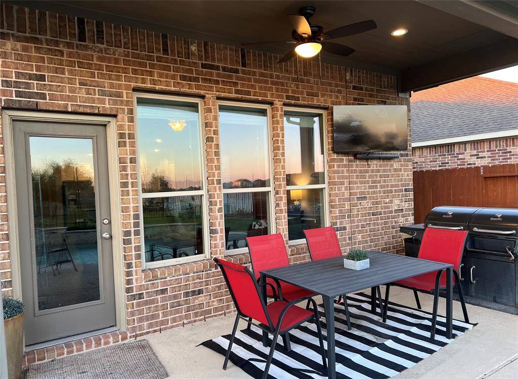 Imagine grilling and watching football on TV while your guests enjoy time in the pool. This home is ready for entertaining.