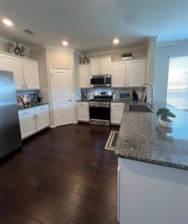 Premium features, upgraded cabinetry,  Frigidaire stainless steel appliance package, custom trim work, designer plumbing Moen fixtures.