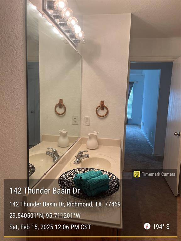 Another view of second bathroom leading to hall.