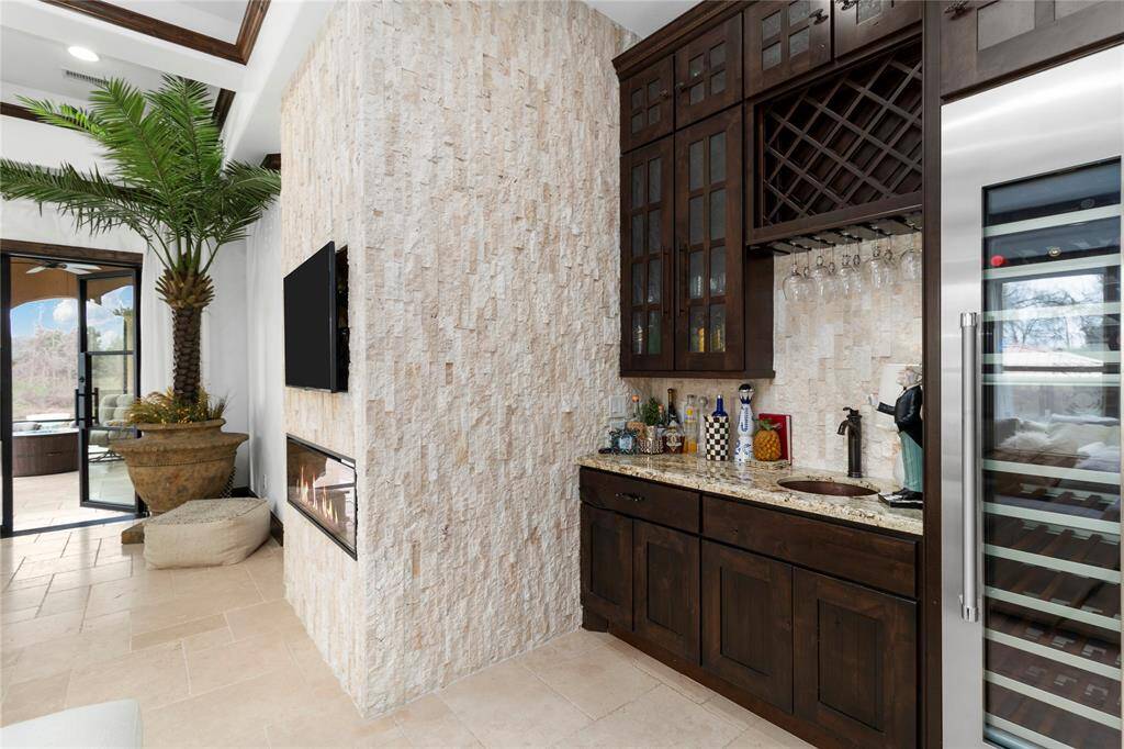 Wet bar with wine refrigerator.