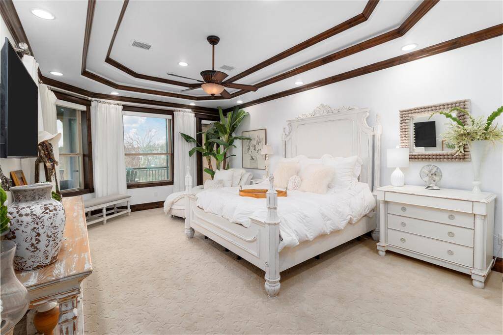 Primary bedroom also has a door leading to the upper balcony.