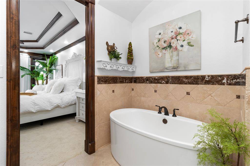 Separate tub in primary bathroom.