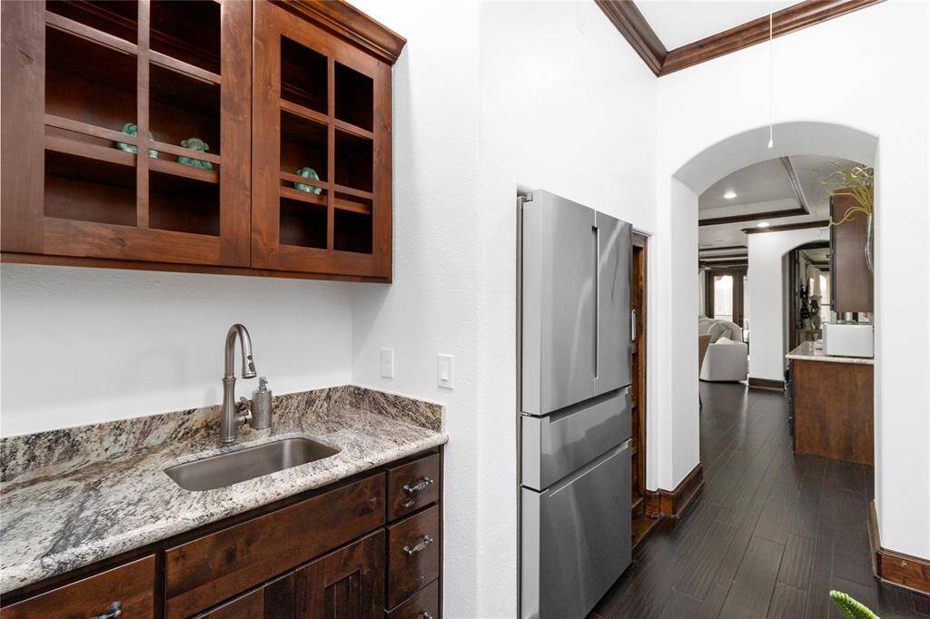 Wet bar upstairs with a full size refrigerator.