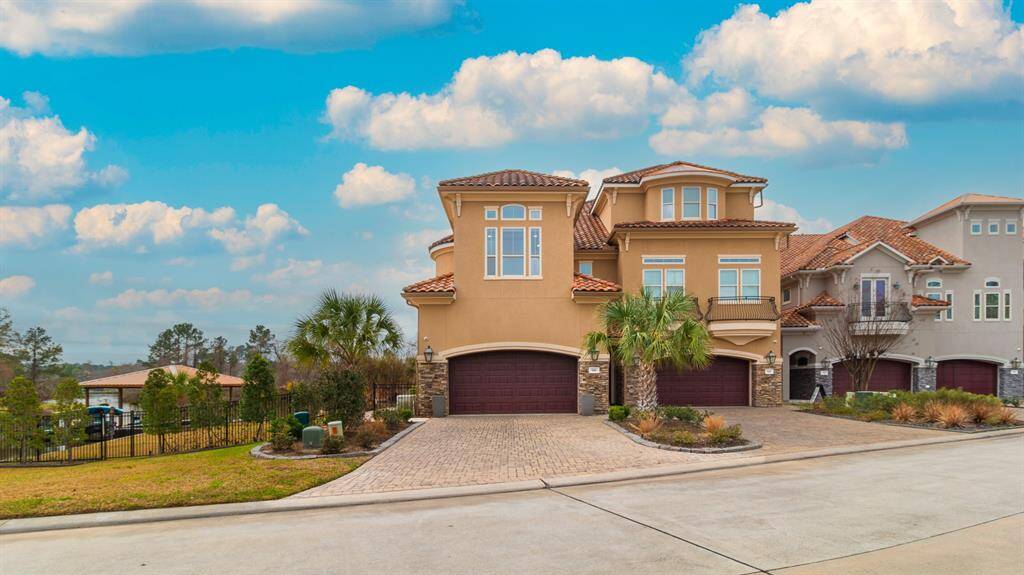 Front of home with extra lot to the left.