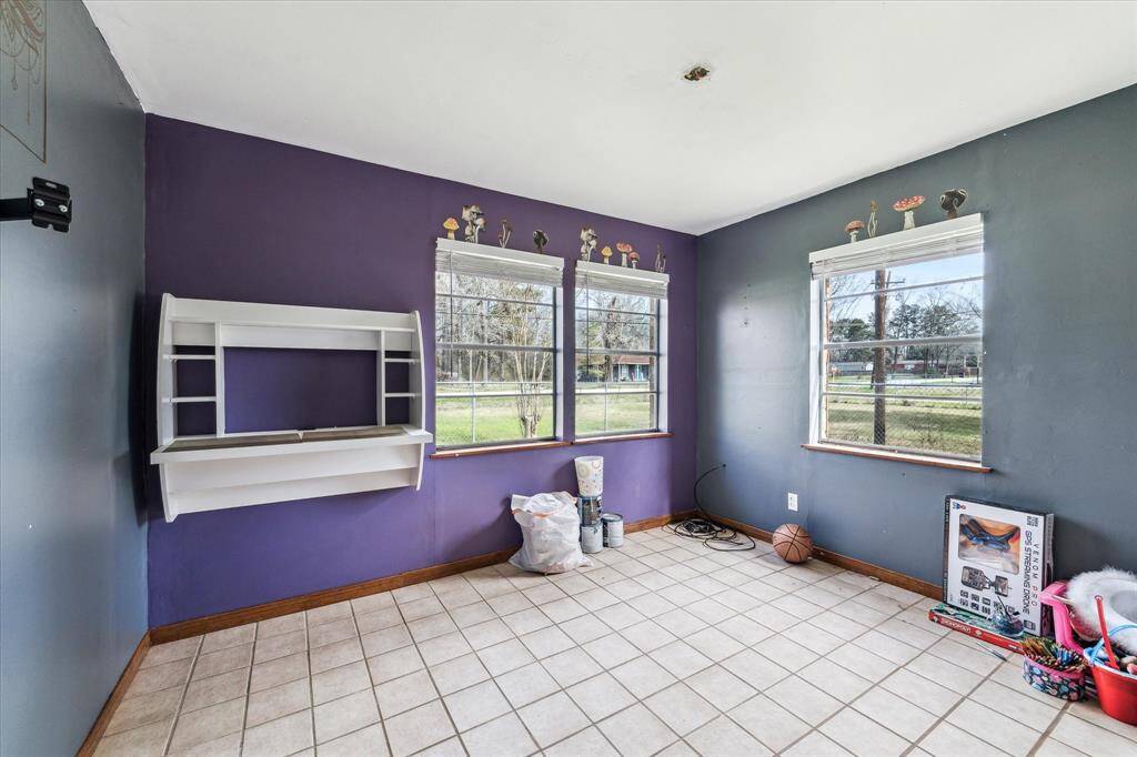 secondary bedroom, with 2nd full bath in the hallway.