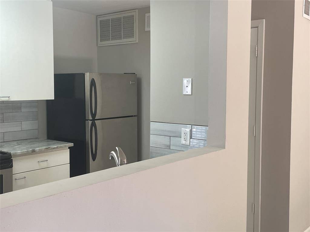 View of kitchen from living area