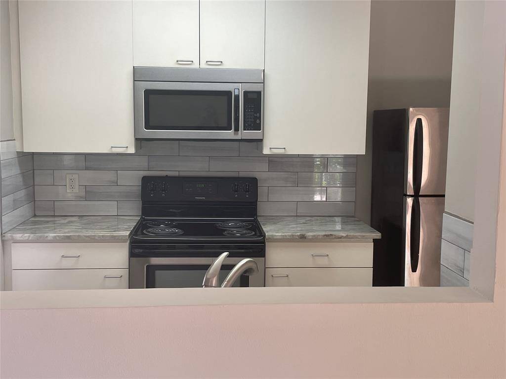 Kitchen with large cabinets