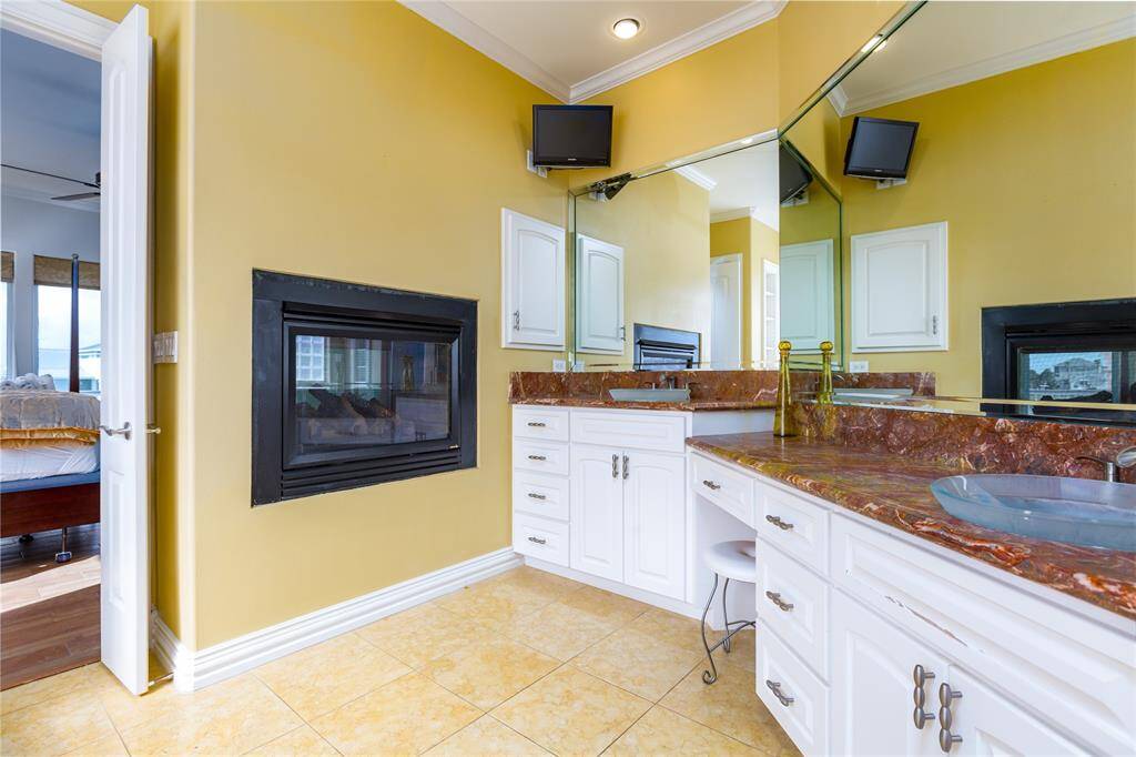 Double sided gas fireplace / double vanity