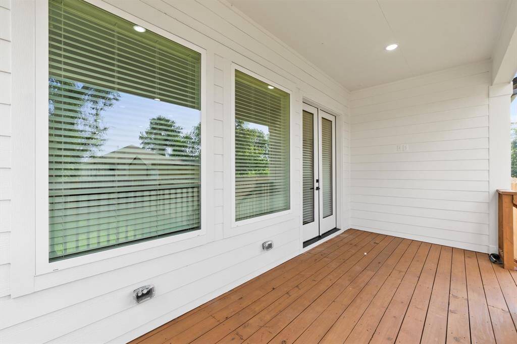 This large porch awaits for your outdoor entertaining needs.