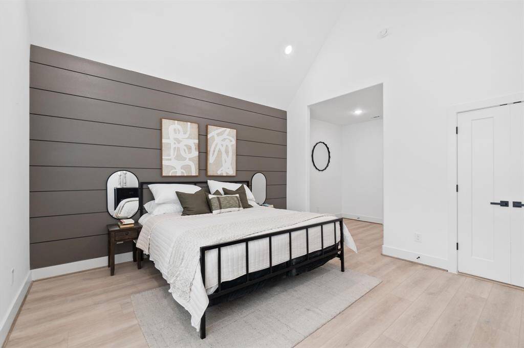 Discover a versatile nook at the primary bedroom entrance, ideal for a dresser, desk, or cozy seating area.