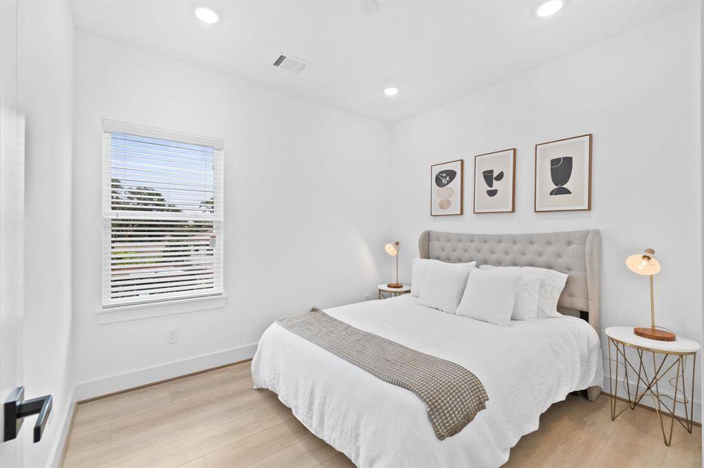 Spacious secondary bedroom with walk-in closet and direct bathroom access.