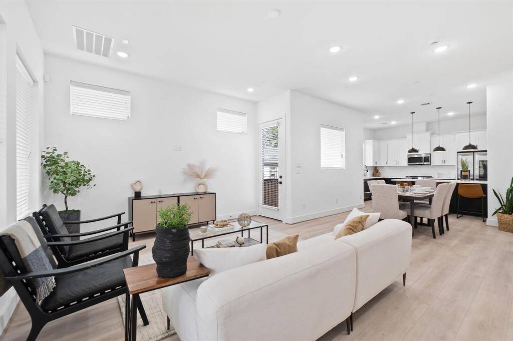 Experience spacious living with abundant natural light and elegant luxury vinyl plank flooring throughout both stories.