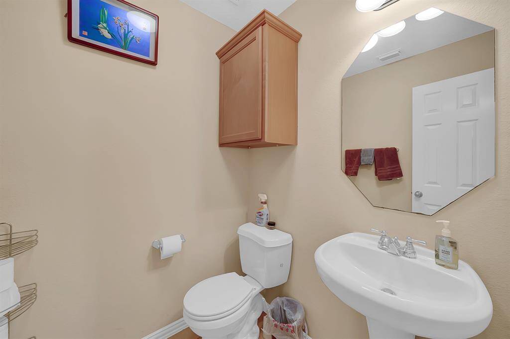 Half bathroom conveniently located for your guests near the dining room and bonus room.