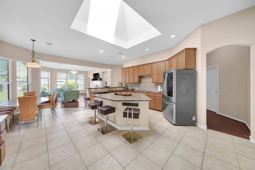 Sky-lit kitchen and a row of living room windows offers plenty of natural lighting.