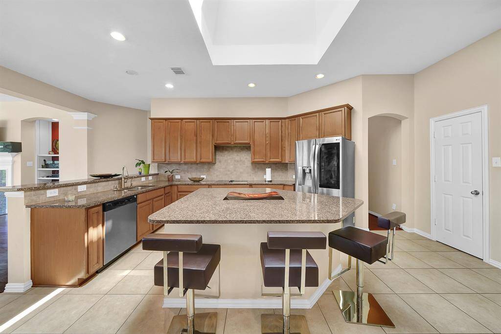 Large kitchen island offers room for breakfast seating.