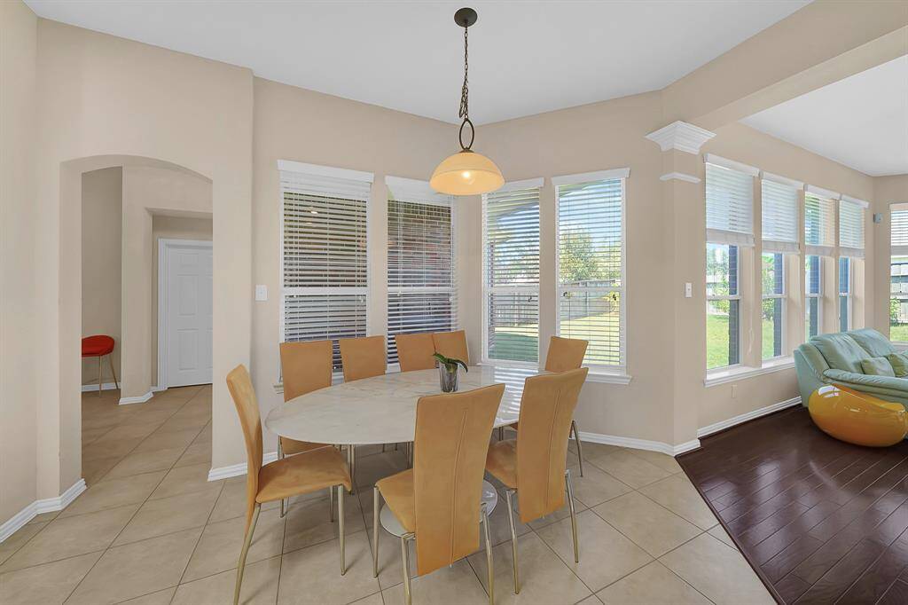 The kitchen is open to breakfast seating and the living room.