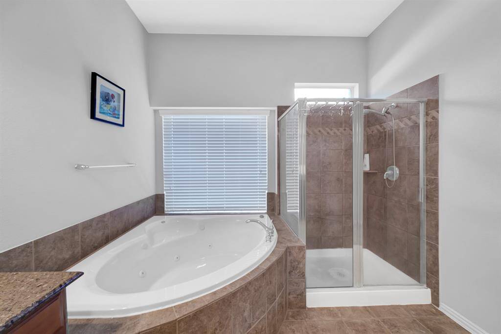 Alternate view of soaking tub and stand alone shower