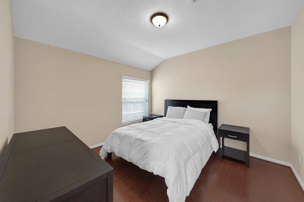 On opposite ends of the computer nook is the entry to 2 bedrooms that are joined by a jack-and-jill bathroom.