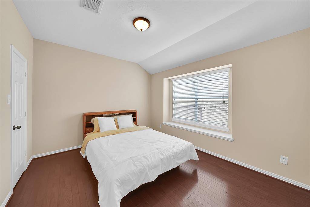 On opposite ends of the computer nook is the entry to 2 bedrooms that are joined by a jack-and-jill bathroom.