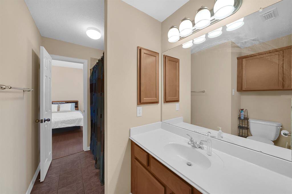 Jack-and-Jill bathroom that connects two secondary bedrooms.