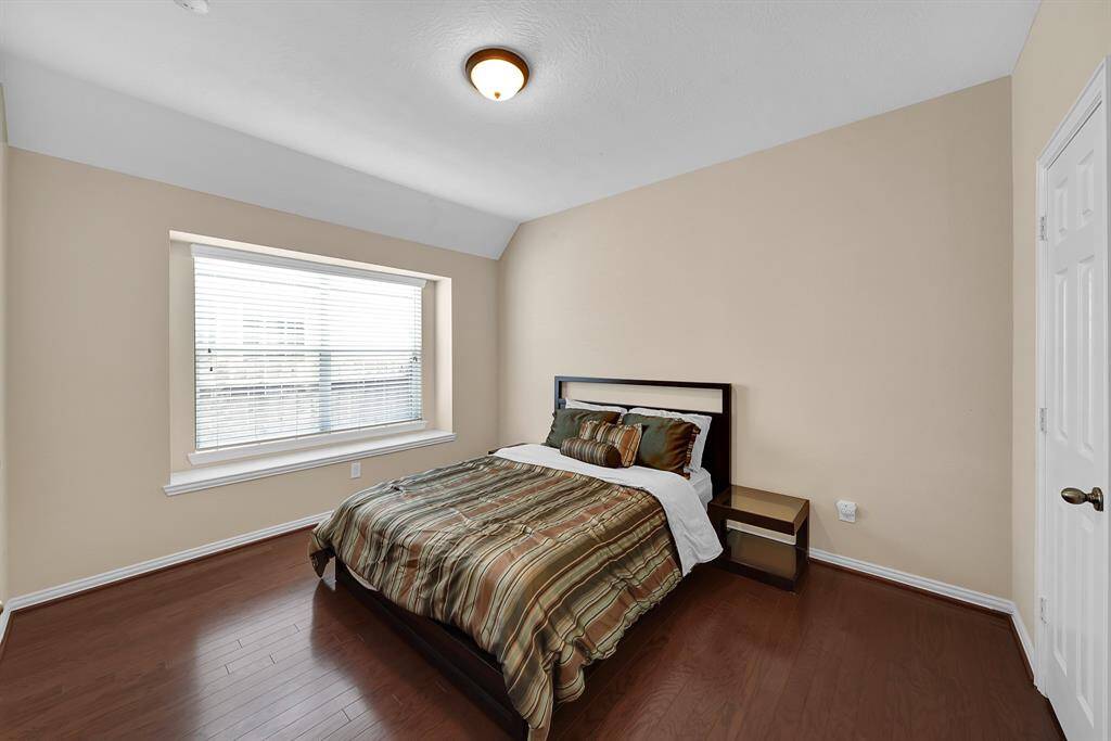 At the rear of the house off the living room is a 4th secondary bedroom with access to another full bathroom.