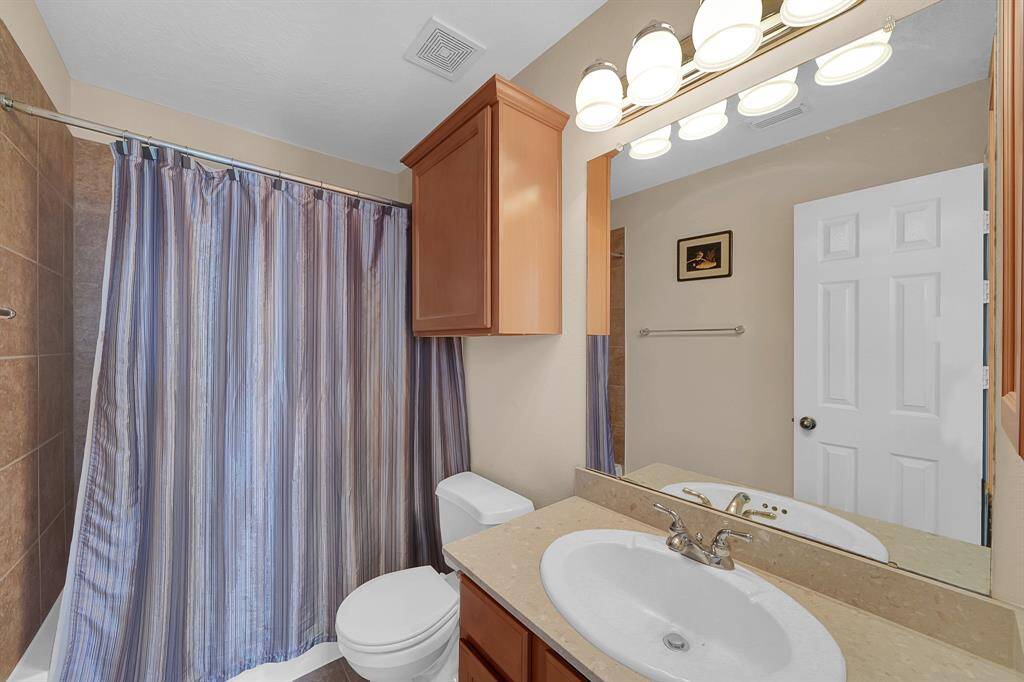 Full bathroom at the rear of the house.