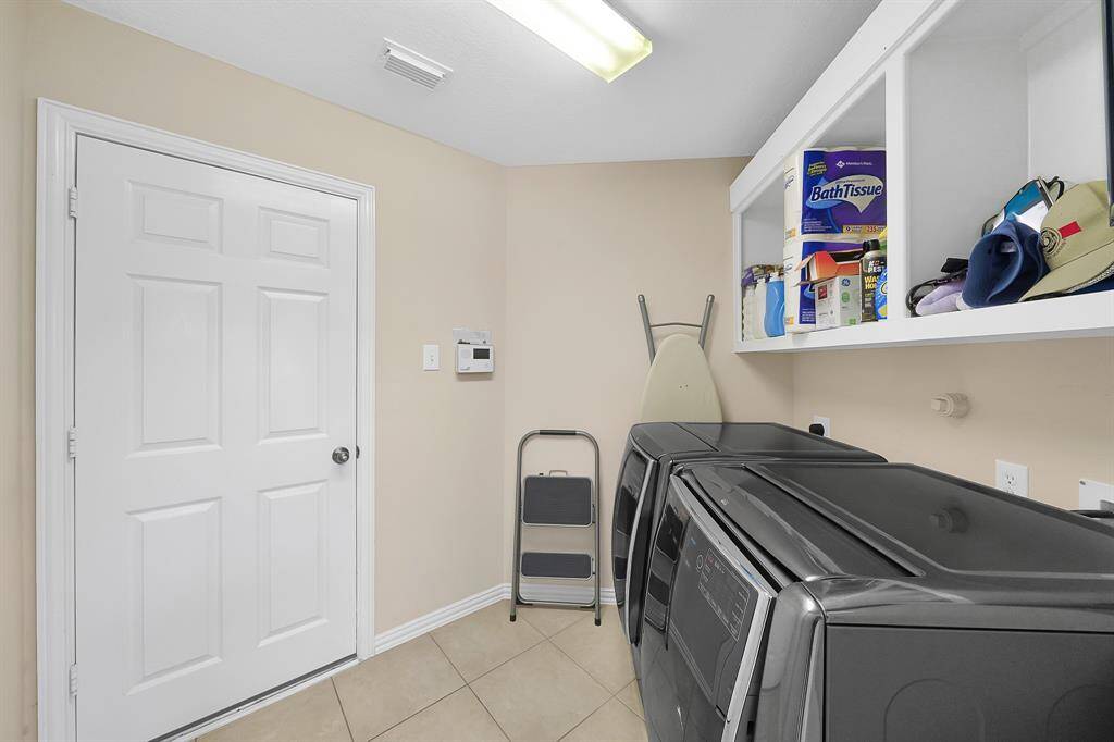 Conveniently located utility room that connects the kitchen to the over-sized 2-car garage.