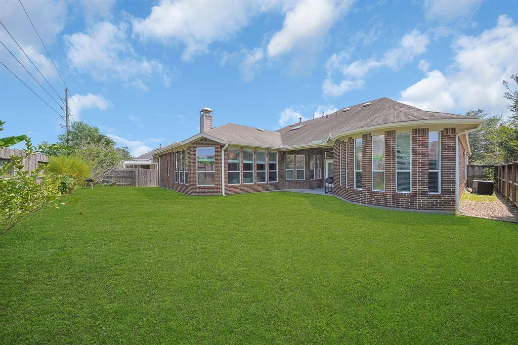 A spacious backyard, fully fenced, waiting to make it yours!