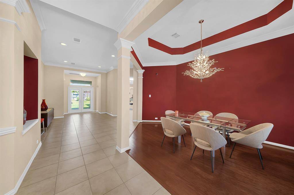 Alternate view of the formal dining room and foyer from the front door.