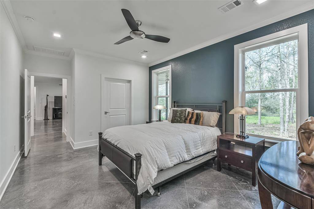 Primary suite offering views of the sprawling acreage