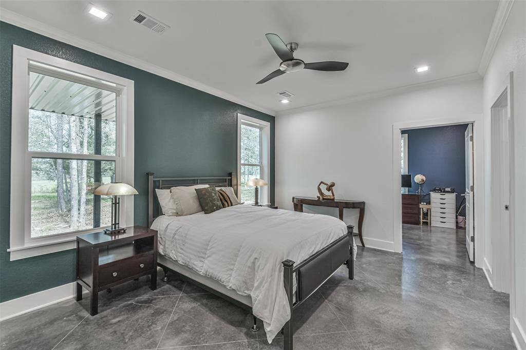 Primary also featuring ceiling fan and access to the en suite primary bath
