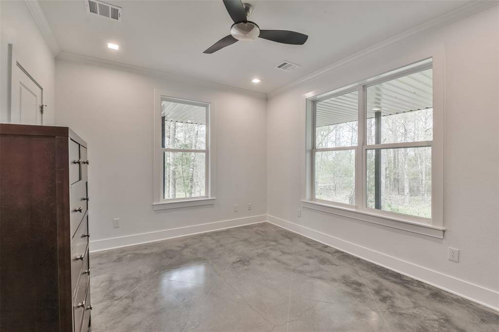 Generously sized secondary bedroom with abundant natural light and easy access to a full bathroom