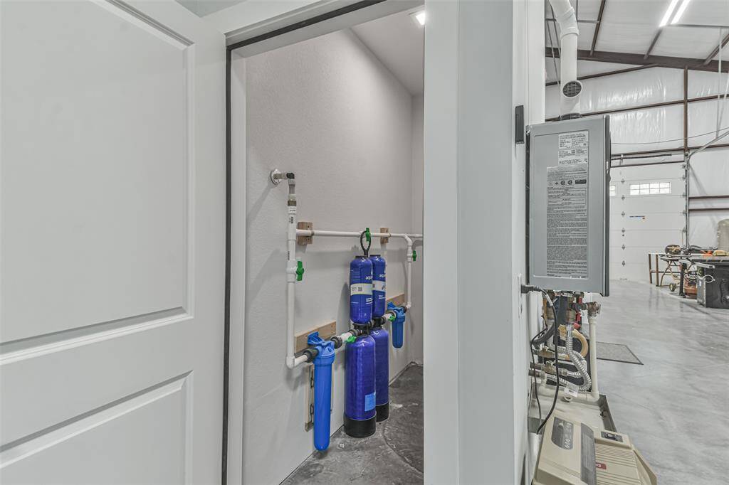 Multi-stage water filtration system ensuring quality water throughout the property and RV power and sewer hook-ups inside the garage workshop.