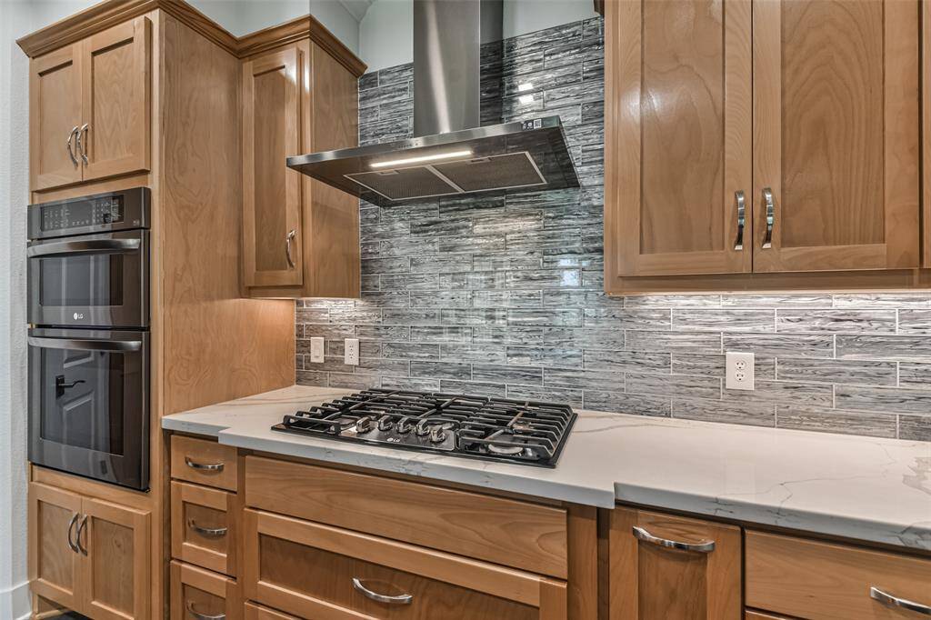 The kitchen exudes sophistication with its designer touches