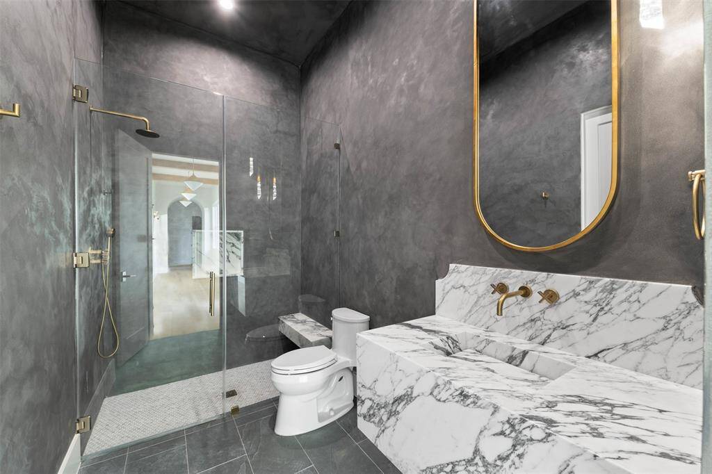 The adjoining ensuite bathroom is a sanctuary of its own, with high-end finishes and a thoughtfully designed layout that elevates the overall sense of luxury. This suite is the perfect balance of relaxation and refined design.