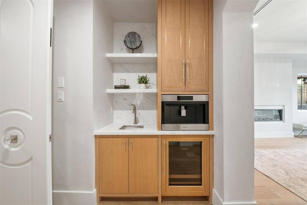 The design is as practical as it is elegant, with carefully considered details that elevate the space. Located just steps from the primary suite, it creates the perfect retreat for morning coffee or an evening cocktail, seamlessly blending comfort and luxury into everyday living.