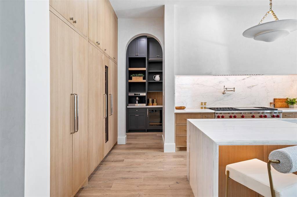 With state-of-the-art appliances and meticulous attention to detail, this kitchen is a chef’s dream and an entertainer’s paradise.