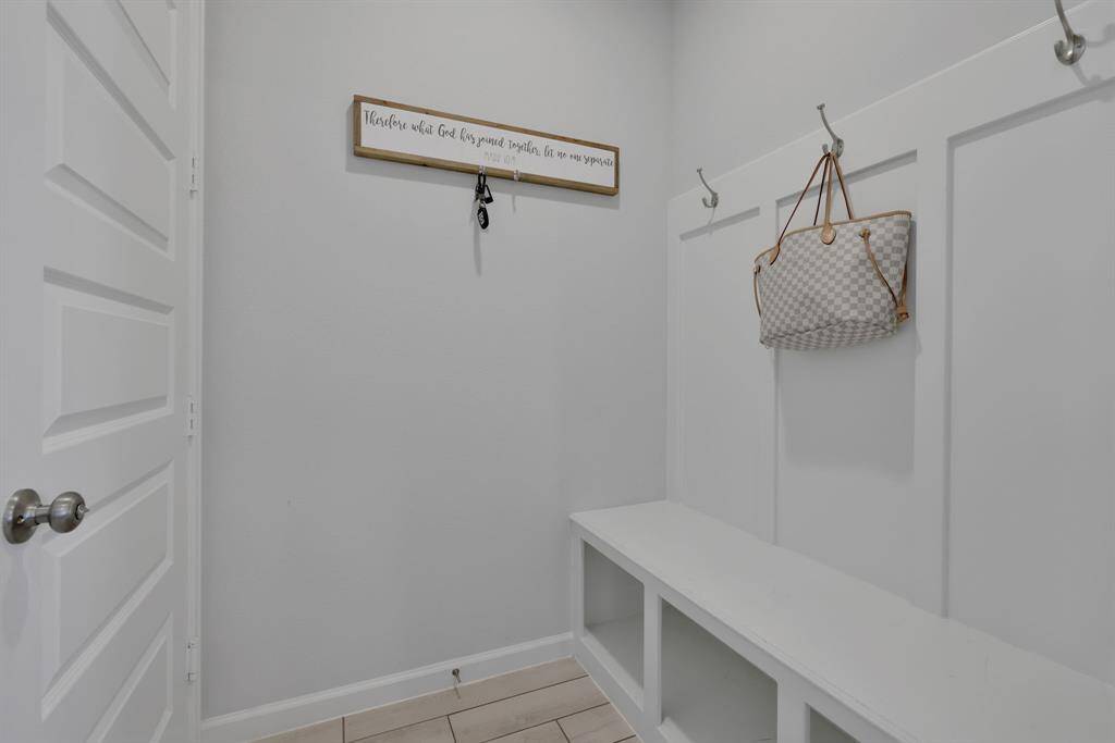 Convenient Mud room offers organization and storage .