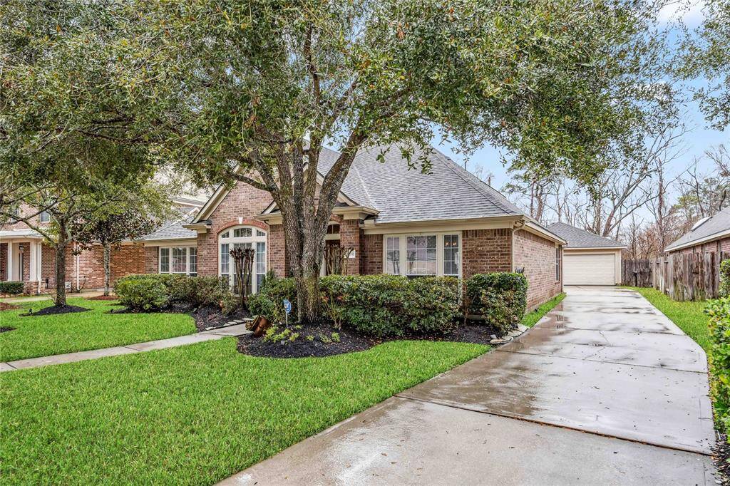 12631 Winding Manor Drive in Summerwood. Spacious 1.5 story home on a greenbelt.