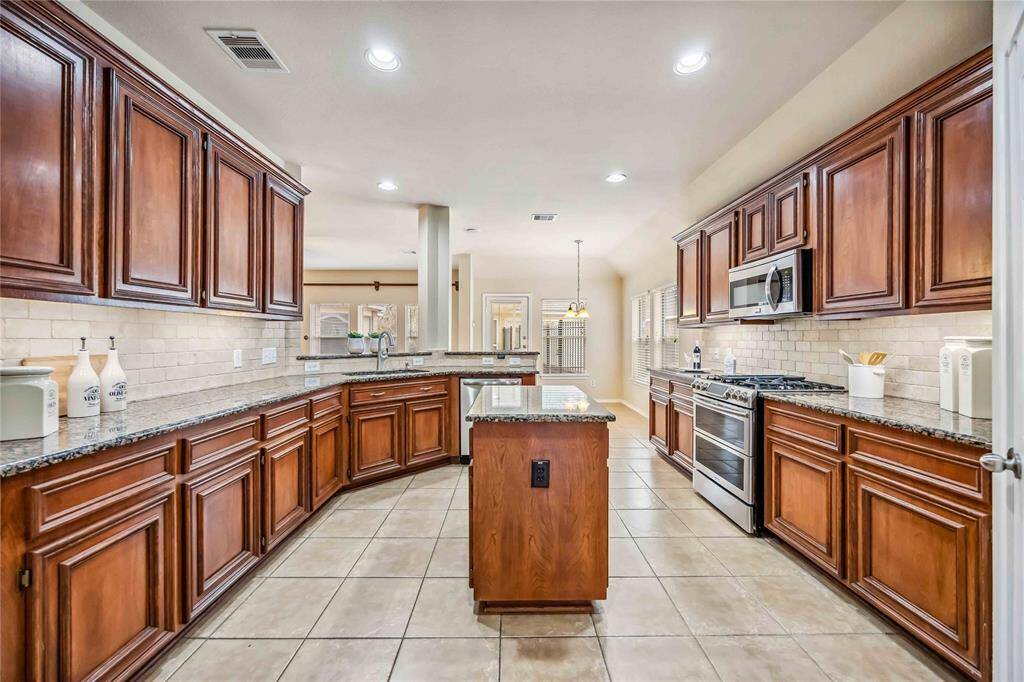 Kitchen with a lot of cabinets and pantry