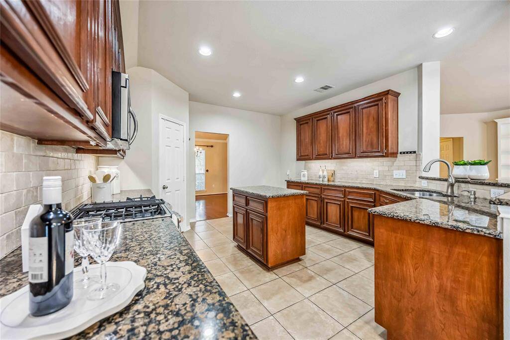 Kitchen with a lot of cabinets and pantry