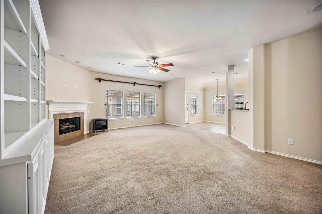 Living room with fireplace and custom build cabinet.