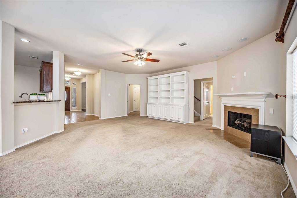 living room with fireplace and custumbuild cabinet