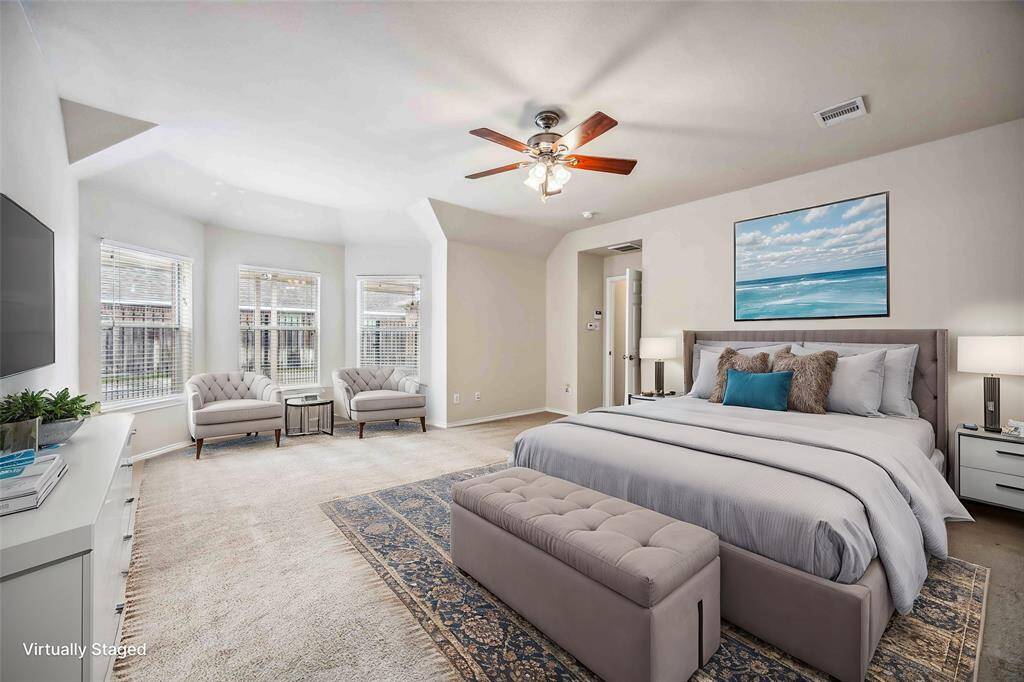 Large primary bedroom with sitting area