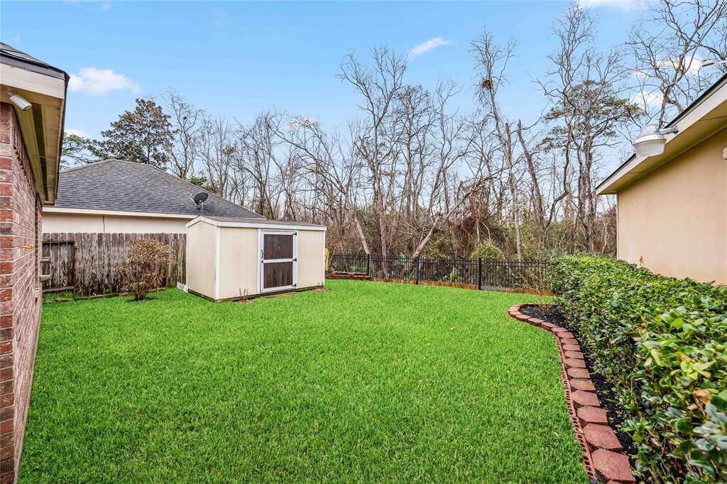 Backyard on greenbelt with storage shed