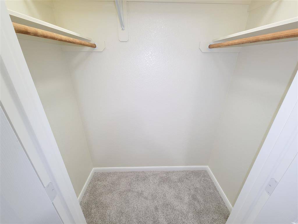 Dual walk in closets in primary bedroom