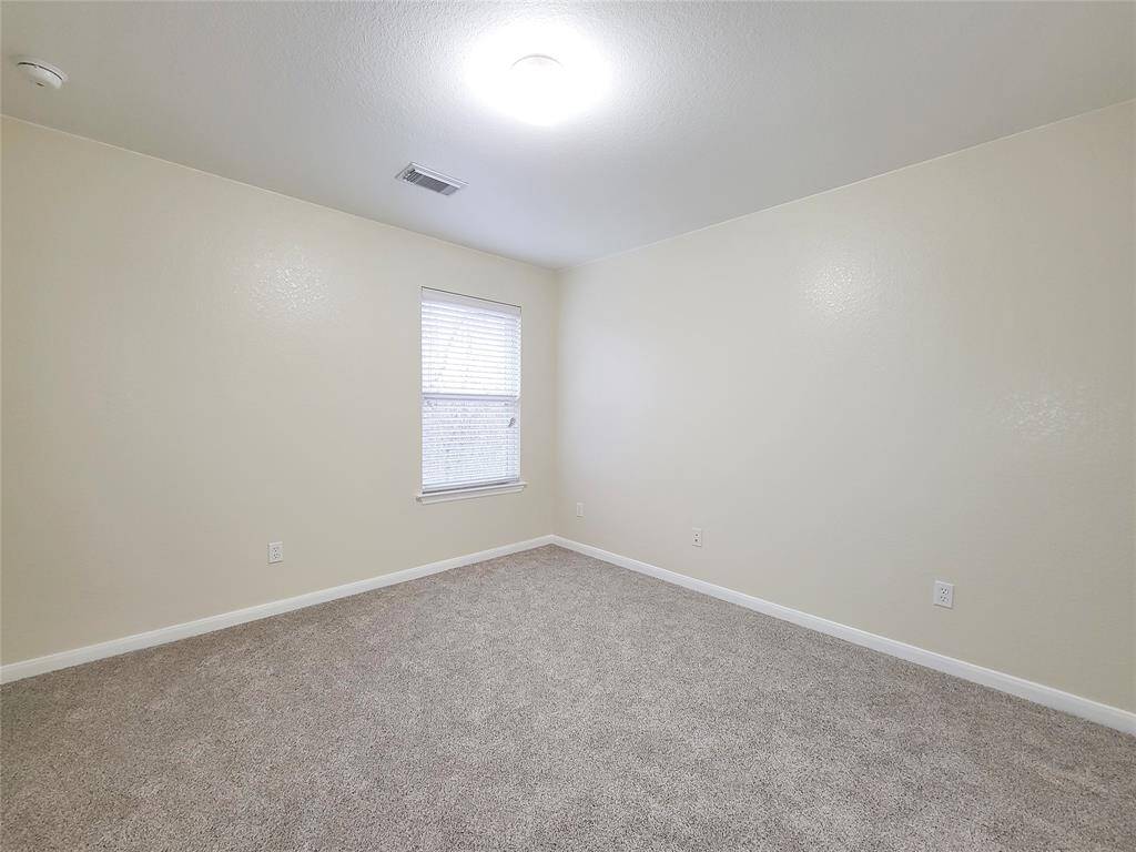 Another view of the secondary bedroom that backs up to a local nature preserve.