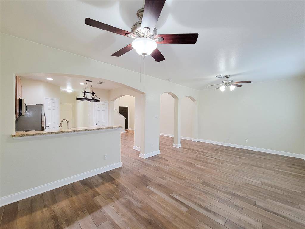 From the kitchen, you can see out into the dining and living areas.