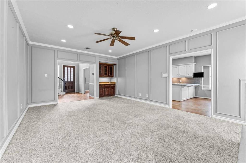 Living Room Looking into Kitchen and Entrance