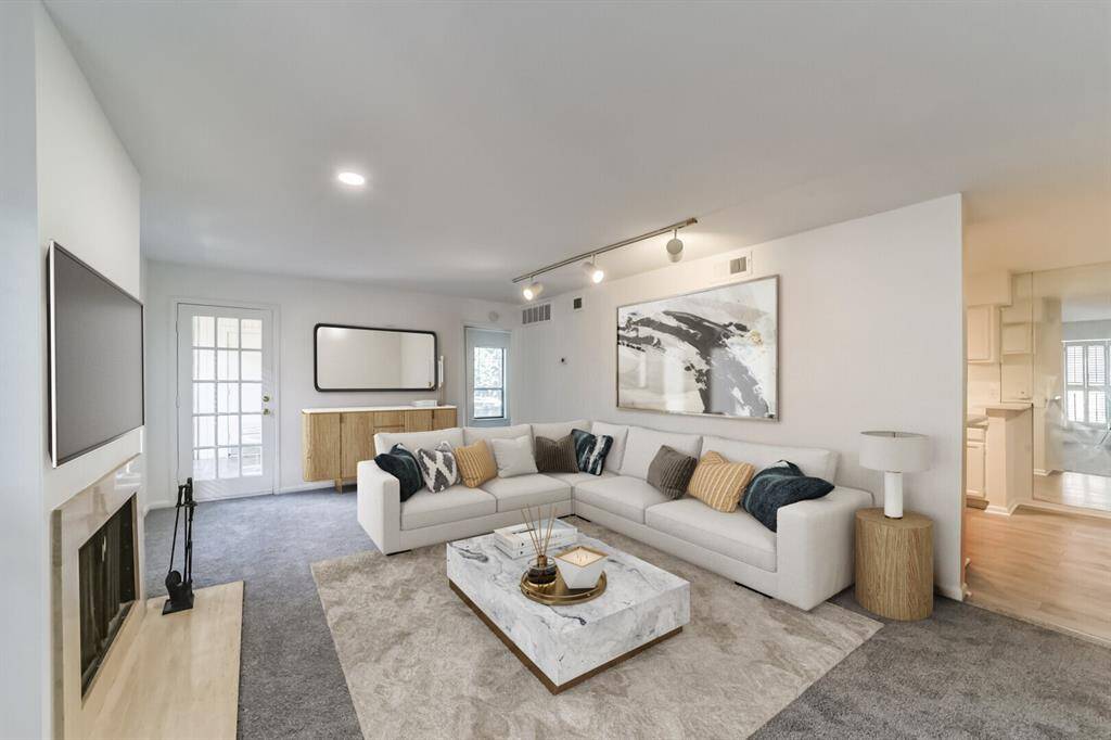 Bright and expansive living area filled with abundant natural light.